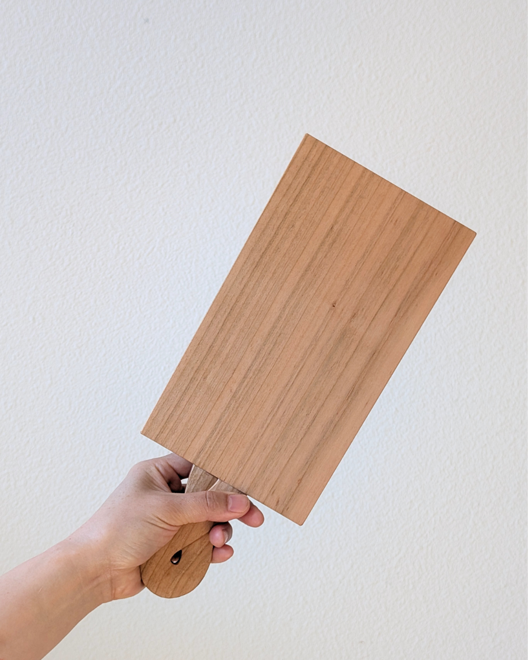 Cherry Wood Cutting Board holding